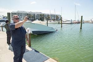 Chief Warrant Officer Todd Wardwell, incident management and environmental response at Coast Guard Sector Delaware Bay, Philadelphia, takes video during port inspections Sept. 15, 2017 in Key West, Florida. 