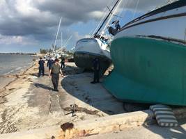 Coast Guard responders inspect and asses grounded sailboats for damage and pollution Sept. 15, 2017 at the Trumbo Point Annex for Naval Air Station Key West following Hurricane Irma.
