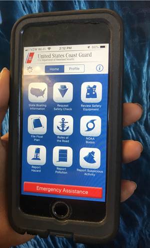 A Coast Guard member displays the home screen of the Coast Guard boating safety app on Aug. 9, 2019, in Portsmouth, Virginia. The Coast Guard app is available for free on every app store, and one feature of the app allows mariners to place an emergency call to the U.S. Coast Guard or 911 while providing the user with their current latitude and longitude to provide to emergency personnel over the phone. (U.S. Coast Guard photo by Petty Officer 3rd Class Shannon Kearney)